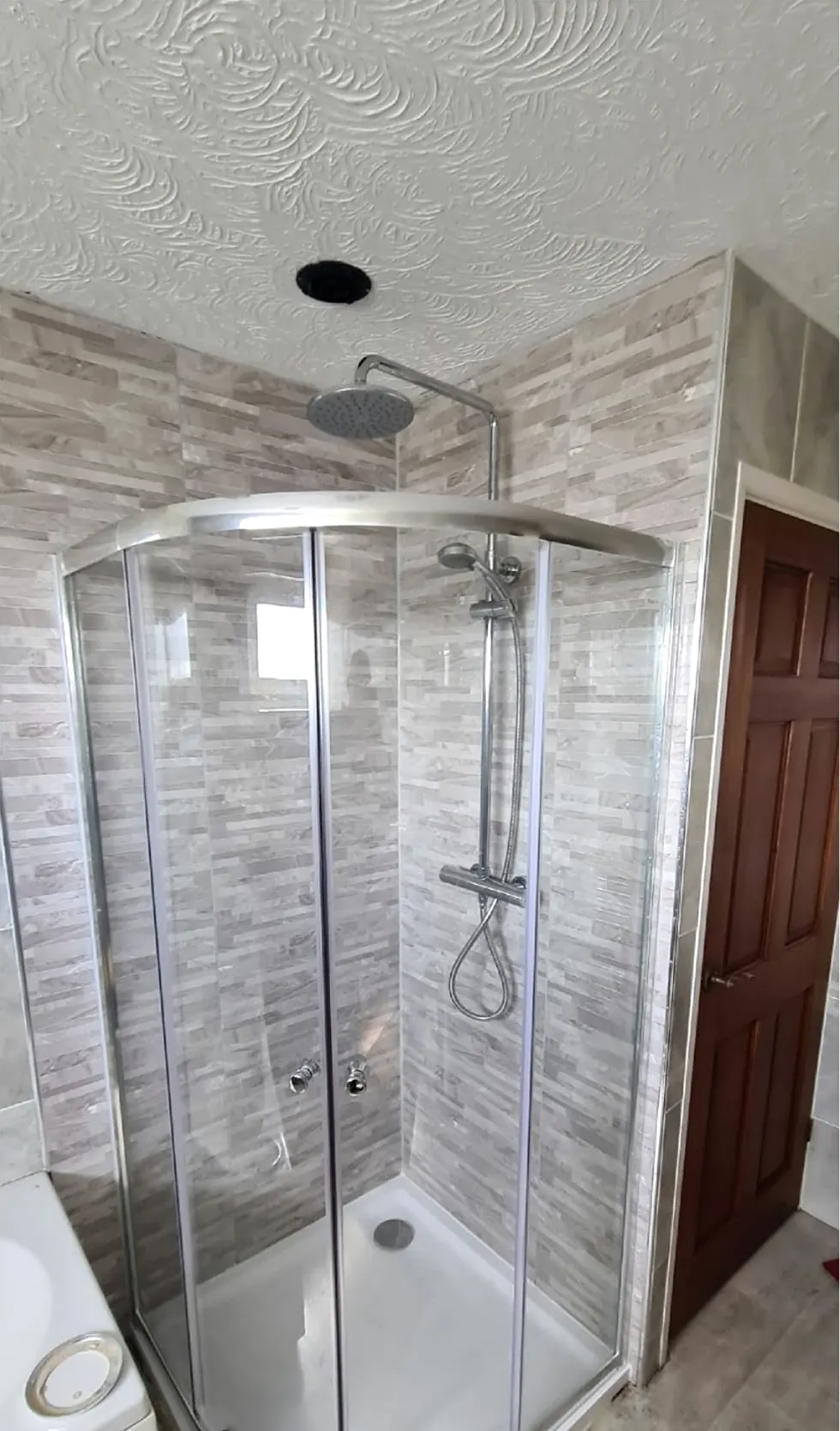 After: quadrant shower with new wall panels