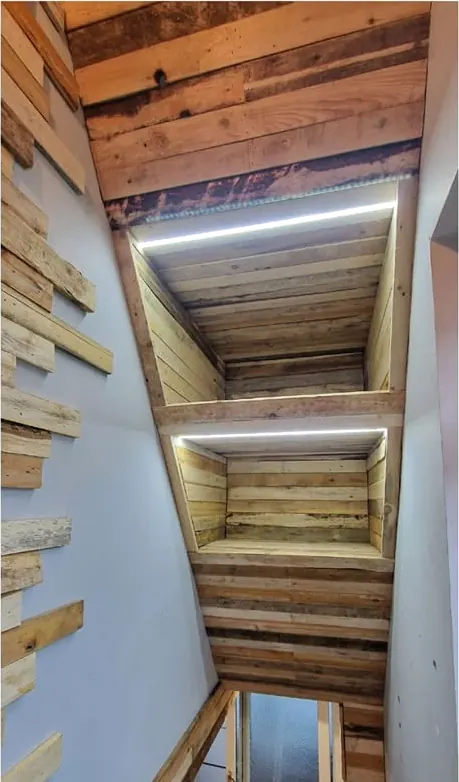 Loft stairs clad in reclaimed wood with LED strips