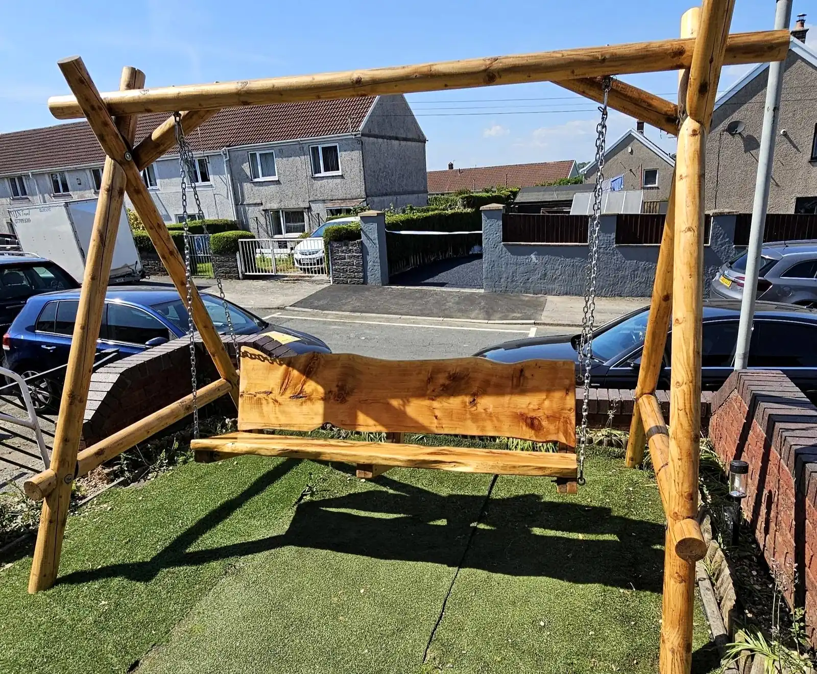 Timber swing seat on a lawn